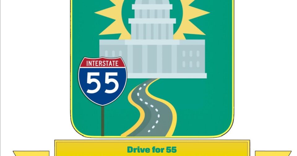 A sun behind the state capital with a sign for interstate route 55.